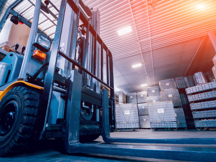 Forklift loader in a warehouse, showing how Gradient supports clients with safety regulations even outside of DOT.