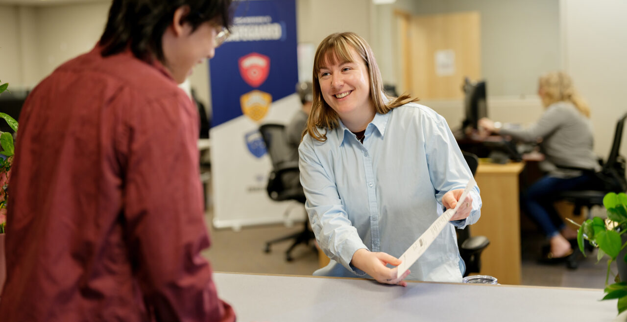 Gradient team member helping a client with DOT compliance paperwork