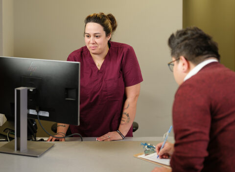 Gradient clinical team member checking in a client for a specimen collection for DOT compliance