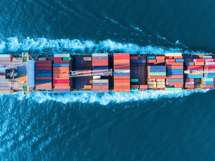 Aerial view of container ship at sea, showing how Gradient supports with USCG compliance solutions